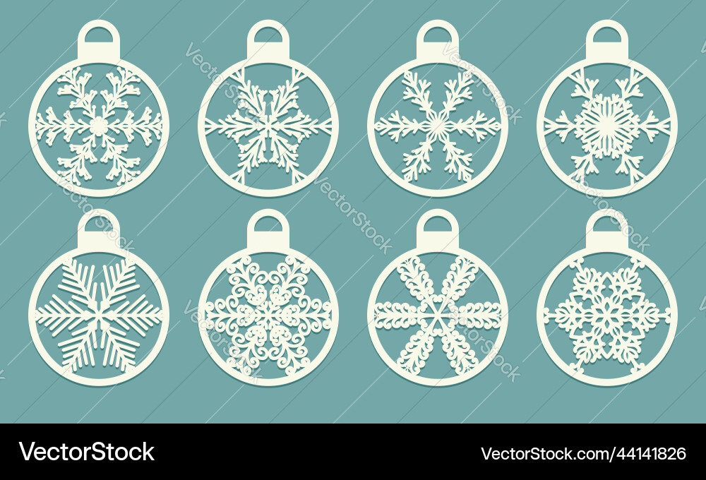Set of cutout balls with snowflakes laser cut Set of cutout balls with snowflakes laser cut vector image