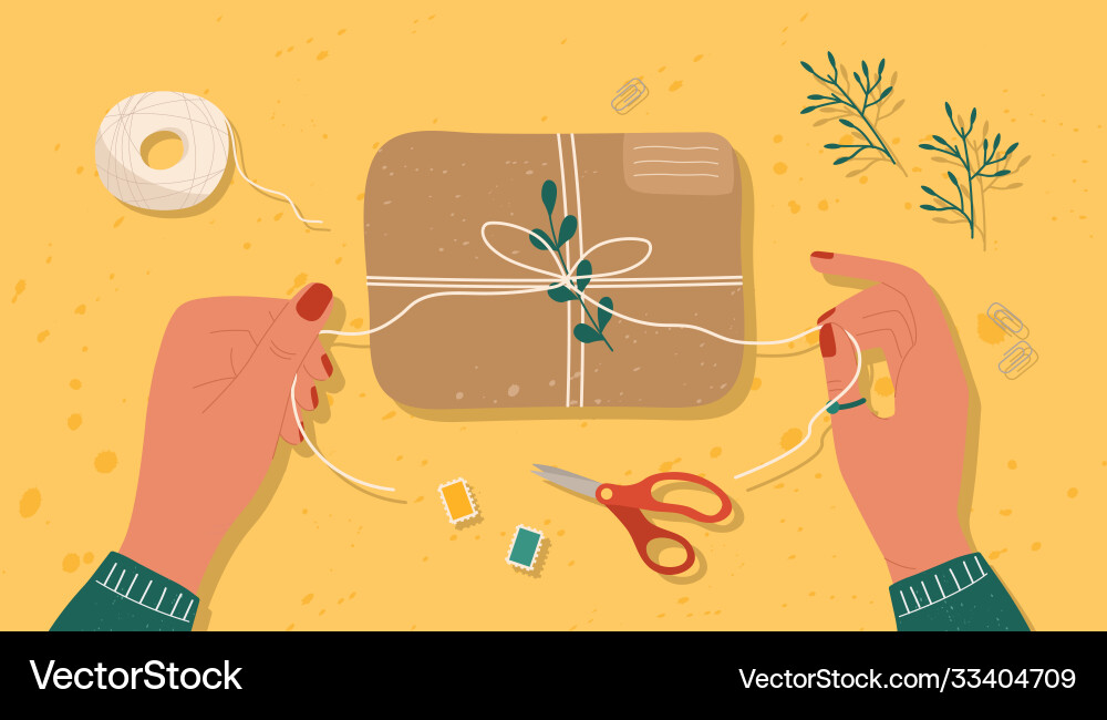 Hands Tying Gift Box with String vector image