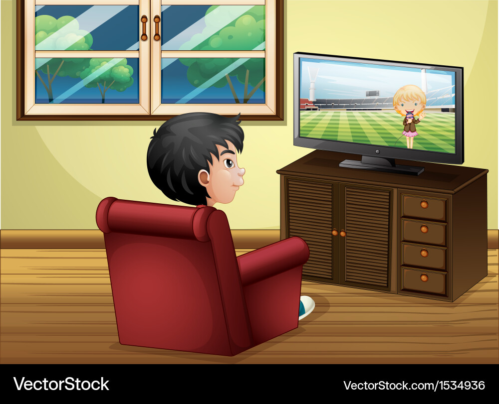 A young boy watching tv at the living room