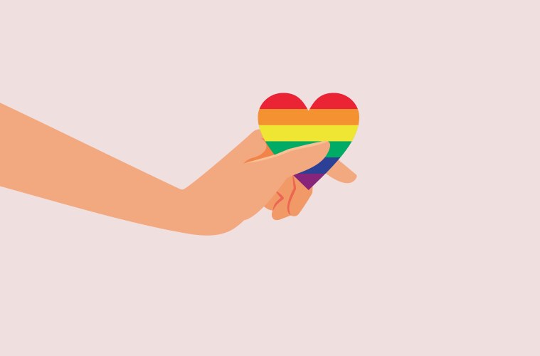 hand holding a rainbow heart symbol of love vector image