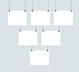 white posters hanging on binder grey wall vector