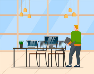 man standing near table with computer at office vector image