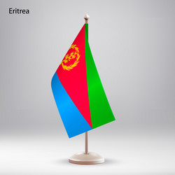 Flag of eritrea hanging on a stand vector