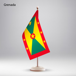 Flag of grenada hanging on a stand vector