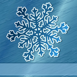 Paper snowflake over steel background vector