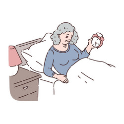 Tired senior woman lie in bed and hold alarm clock vector