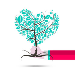 Heart shaped tree in human hand vector