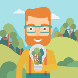 man with lightbulb and trees inside vector image
