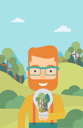 man with lightbulb and trees inside vector image