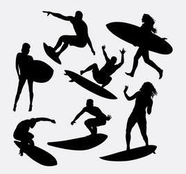 Surfer Silhouettes - Male & Female Vector Image