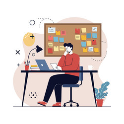 man working at desk with laptop and notes vector image