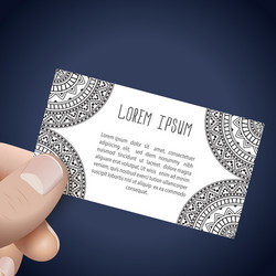 hand with business card in ethnic style vector