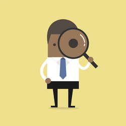 businessman looking through a magnifying glass vector