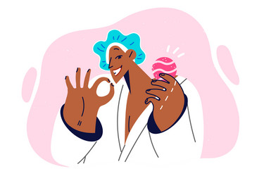 Woman with bath bomb in hands shows gesture of ok vector