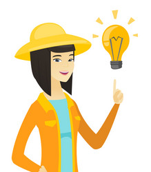 young asian farmer pointing at idea light bulb vector