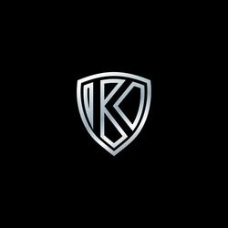 silver shield logo design for letter k vector