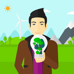 man with lightbulb and trees inside vector image