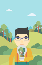 man with lightbulb and trees inside vector image