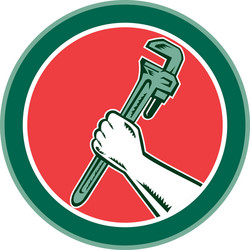 Hand holding adjustable wrench circle woodcut vector