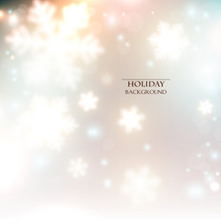 white defocused snowflakes on glow background vector