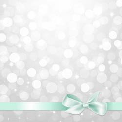 silver glitter bokeh with bow vector