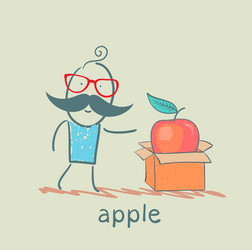 man opens a box with an apple vector image