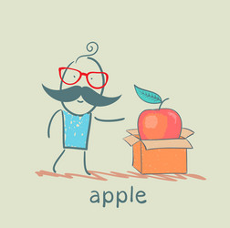 man opens a box with an apple vector