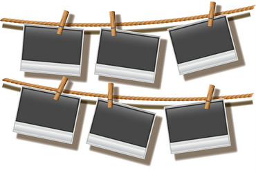 Retro photo frames hanging on rope isolated Vector Image
