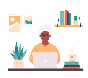 Black old woman working on computer at home vector