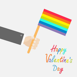 Businessman hand holding rainbow gay pride flag vector