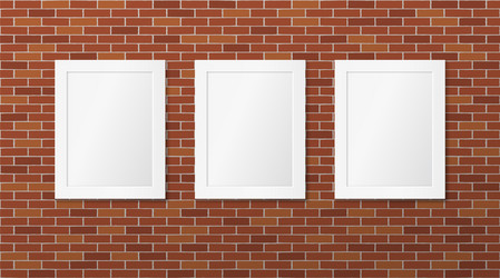 Two white picture frames on a brick wall Vector Image