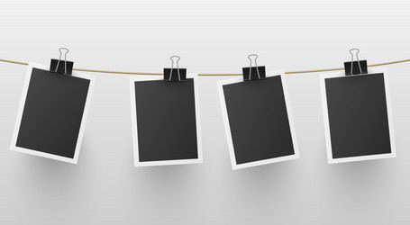 set retro blank photo frames hanged on rope vector