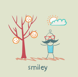 A man stands next to tree on which grow smilies vector