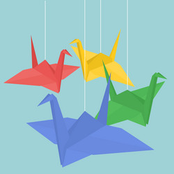 Hanging origami paper cranes in various color vector