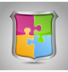 Shield with puzzle pieces vector image