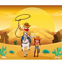 A cowboy and a cowgirl at the desert vector image