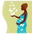 Silhouette of pregnant woman with flowers vector image