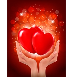 Valentines day background Hands holding two red vector image