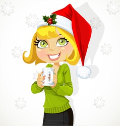Cute girl in Santa hat hold cup of hot drink vector image