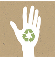Reuse sign on hand silhouette on recycled paper E vector image