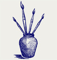 Brushes in vase vector image