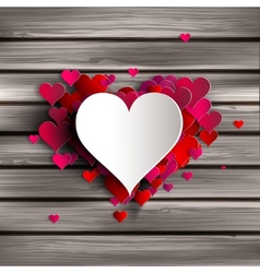 Abstract heart on wooden background vector image