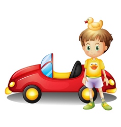 A young boy with a rubber duck and a big toy car vector image