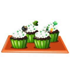 A tray with four chocolate cupcakes vector image