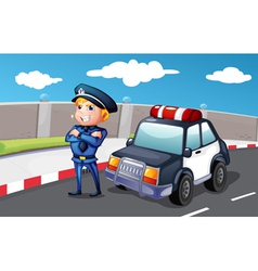 A smiling police officer at the street vector image