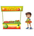 A young boy selling fruits vector image