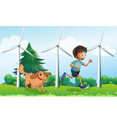 A boy and his dog near the three windmills vector image
