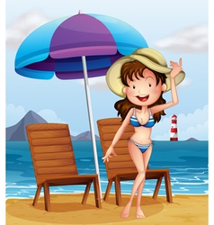 A woman wearing a stripe swimsuit at the beach vector image