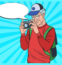 Mature man taking picture with camera pop art vector image