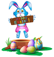 A rabbit holding an easter greeting vector image